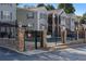 Community pool area features secure fencing and charming stone pillar accents at 1102 Madison Ln # 1102, Smyrna, GA 30080
