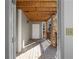Outdoor porch entrance with wooden flooring and stone pillars for support at 1102 Madison Ln # 1102, Smyrna, GA 30080