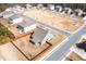 Wide aerial view of the property showcasing the fenced backyard, surrounding neighborhood, and street layout at 1809 Hanwoo Ln, Powder Springs, GA 30127
