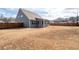 Large backyard with a screen porch and privacy fence, perfect for outdoor activities at 1809 Hanwoo Ln, Powder Springs, GA 30127