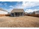 Large backyard with a screened porch and privacy fence, creating a private and inviting outdoor space at 1809 Hanwoo Ln, Powder Springs, GA 30127