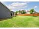 Expansive backyard enclosed by a wooden fence, perfect for outdoor enjoyment at 1809 Hanwoo Ln, Powder Springs, GA 30127