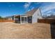 Spacious backyard with a screen porch and a privacy fence for relaxation and entertainment at 1809 Hanwoo Ln, Powder Springs, GA 30127