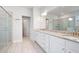 Bathroom features granite countertops, dual sinks, a glass shower enclosure, and modern fixtures at 1809 Hanwoo Ln, Powder Springs, GA 30127