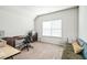 Bright, airy bedroom featuring a large window, desk, and seating area at 1809 Hanwoo Ln, Powder Springs, GA 30127