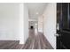 View from the entryway into the home's open-concept living space at 1809 Hanwoo Ln, Powder Springs, GA 30127