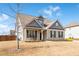 Inviting front of the house with lush lawn and an outdoor seating area at 1809 Hanwoo Ln, Powder Springs, GA 30127