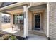 Inviting front porch and craftsman style door with outdoor seating at 1809 Hanwoo Ln, Powder Springs, GA 30127