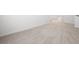 A neutral colored, carpeted hallway with white walls and baseboards at 1809 Hanwoo Ln, Powder Springs, GA 30127