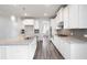 Bright kitchen featuring granite countertops, stainless appliances, white cabinetry, and a large center island at 1809 Hanwoo Ln, Powder Springs, GA 30127