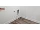 Corner of laundry room features modern laminate floors at 1809 Hanwoo Ln, Powder Springs, GA 30127