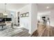 Spacious view of an open-concept living space with stylish floors and white wall trim at 1809 Hanwoo Ln, Powder Springs, GA 30127