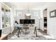 Bright office space featuring large windows, wainscoting, stylish light fixture, and neutral-toned rug at 1809 Hanwoo Ln, Powder Springs, GA 30127