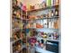 Walk-in pantry with metal shelving, stocked with various food items and household goods at 1809 Hanwoo Ln, Powder Springs, GA 30127