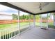 Screened porch with white railings overlooking a spacious, green backyard at 1809 Hanwoo Ln, Powder Springs, GA 30127