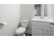 Simple powder room features modern toilet, flooring and vanity at 1809 Hanwoo Ln, Powder Springs, GA 30127