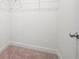 A simple walk-in closet with wire shelving and carpet at 1809 Hanwoo Ln, Powder Springs, GA 30127