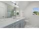 Bathroom with marble countertop and glass shower offering modern elegance and style at 4253 Biltmore Pl, Marietta, GA 30062