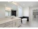 Luxurious bathroom showcasing dual vanities, a freestanding tub, and stylish finishes at 4253 Biltmore Pl, Marietta, GA 30062