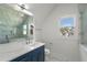 Bathroom with marble countertop and glass shower offering modern elegance and style at 4253 Biltmore Pl, Marietta, GA 30062
