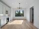 Bright dining room features hardwood floors, modern light fixture, and a large window at 4253 Biltmore Pl, Marietta, GA 30062