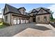 Stunning stone home featuring a three-car garage and a paved driveway, perfect for luxury living at 4253 Biltmore Pl, Marietta, GA 30062