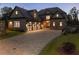 Beautiful stone home featuring a large driveway and a three-car garage, combining style and functionality at 4253 Biltmore Pl, Marietta, GA 30062
