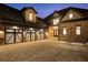 Charming stone home with a spacious driveway leading to a three-car garage, offering luxury curb appeal at 4253 Biltmore Pl, Marietta, GA 30062