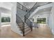 Spacious foyer with modern staircase, hardwood floors, and ample natural light offering an inviting entrance at 4253 Biltmore Pl, Marietta, GA 30062