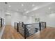 Hallway area featuring wood floors and black metal railing at 4253 Biltmore Pl, Marietta, GA 30062