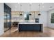 Modern kitchen with quartz countertops, stainless steel appliances, and a large island at 4253 Biltmore Pl, Marietta, GA 30062