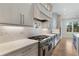 Elegant kitchen featuring quartz countertops, stainless steel appliances, and custom cabinetry at 4253 Biltmore Pl, Marietta, GA 30062