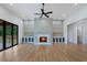 Bright living room featuring a fireplace, built-in cabinets, and sliding glass doors for seamless indoor-outdoor living at 4253 Biltmore Pl, Marietta, GA 30062