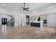 Open living space with hardwood floors connects to a gourmet kitchen and staircase at 4253 Biltmore Pl, Marietta, GA 30062