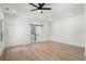 Bright and airy main bedroom with hardwood floors, ceiling fan and ensuite bathroom at 4253 Biltmore Pl, Marietta, GA 30062
