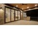 Covered brick patio with a built-in grill and large sliding glass doors to the interior at 4253 Biltmore Pl, Marietta, GA 30062