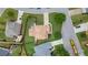 An aerial view of a well-maintained home featuring a manicured lawn and established landscaping in a suburban setting at 5805 Fielding Ct, Cumming, GA 30041