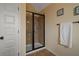 Tiled bathroom featuring a glass shower, a towel rack, and a clean design at 5805 Fielding Ct, Cumming, GA 30041