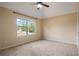 Bedroom with large window and neutral carpet at 5805 Fielding Ct, Cumming, GA 30041
