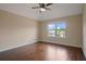 Bedroom with ceiling fan, natural light and hardwood floors at 5805 Fielding Ct, Cumming, GA 30041