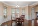 Cozy breakfast nook with hardwood floors and three large windows providing ample natural light at 5805 Fielding Ct, Cumming, GA 30041