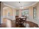 Charming breakfast nook with dark hardwood floors, wainscoting and natural light at 5805 Fielding Ct, Cumming, GA 30041