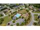 Aerial image of a neighborhood pool with lounge chairs, landscaping, playground, and parking at 5805 Fielding Ct, Cumming, GA 30041