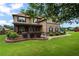 Charming two-story home features a well-manicured lawn, brick accents, and inviting front porch at 5805 Fielding Ct, Cumming, GA 30041