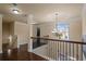 Upstairs hallway with hardwood floors, chandelier and natural light at 5805 Fielding Ct, Cumming, GA 30041