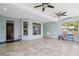 Bright sunroom with tile floors, a hanging chair, and ample natural light at 5805 Fielding Ct, Cumming, GA 30041