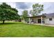 Expansive backyard view showcasing a covered patio and abundant green space at 7925 Silversmith Dr, Cumming, GA 30028