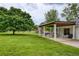 Well-maintained backyard featuring a covered patio area and plenty of space for outdoor activities at 7925 Silversmith Dr, Cumming, GA 30028