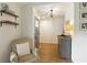 Bright entryway with wood floors, stylish shelving, and neutral decor at 7925 Silversmith Dr, Cumming, GA 30028