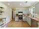 Bright kitchen with stainless appliances, butcher block counters, and stylish open shelving at 7925 Silversmith Dr, Cumming, GA 30028